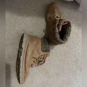 Worn woman’s combat boots. Tan with patter at top. Side 8
